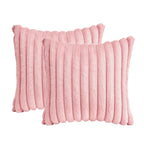 Two pink textured pillows on a white background