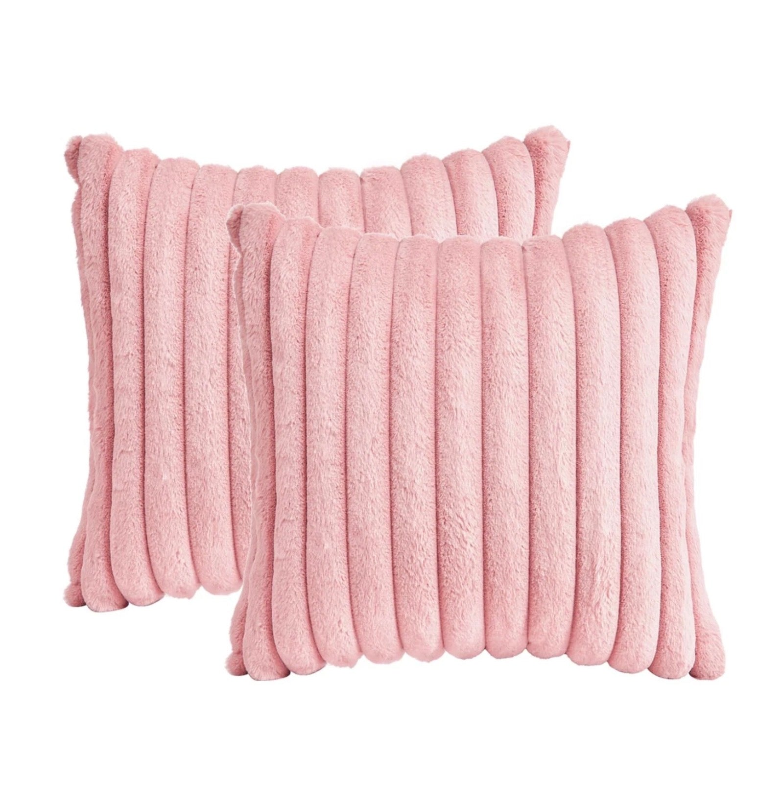 Two pink textured pillows on a white background