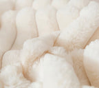 Close-up of a textured beige fabric cushion surface 