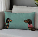 Decorative pillow with dachshund illustrations on a gray couch