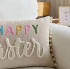 Decorative pillow with 'Happy Easter' text on a couch