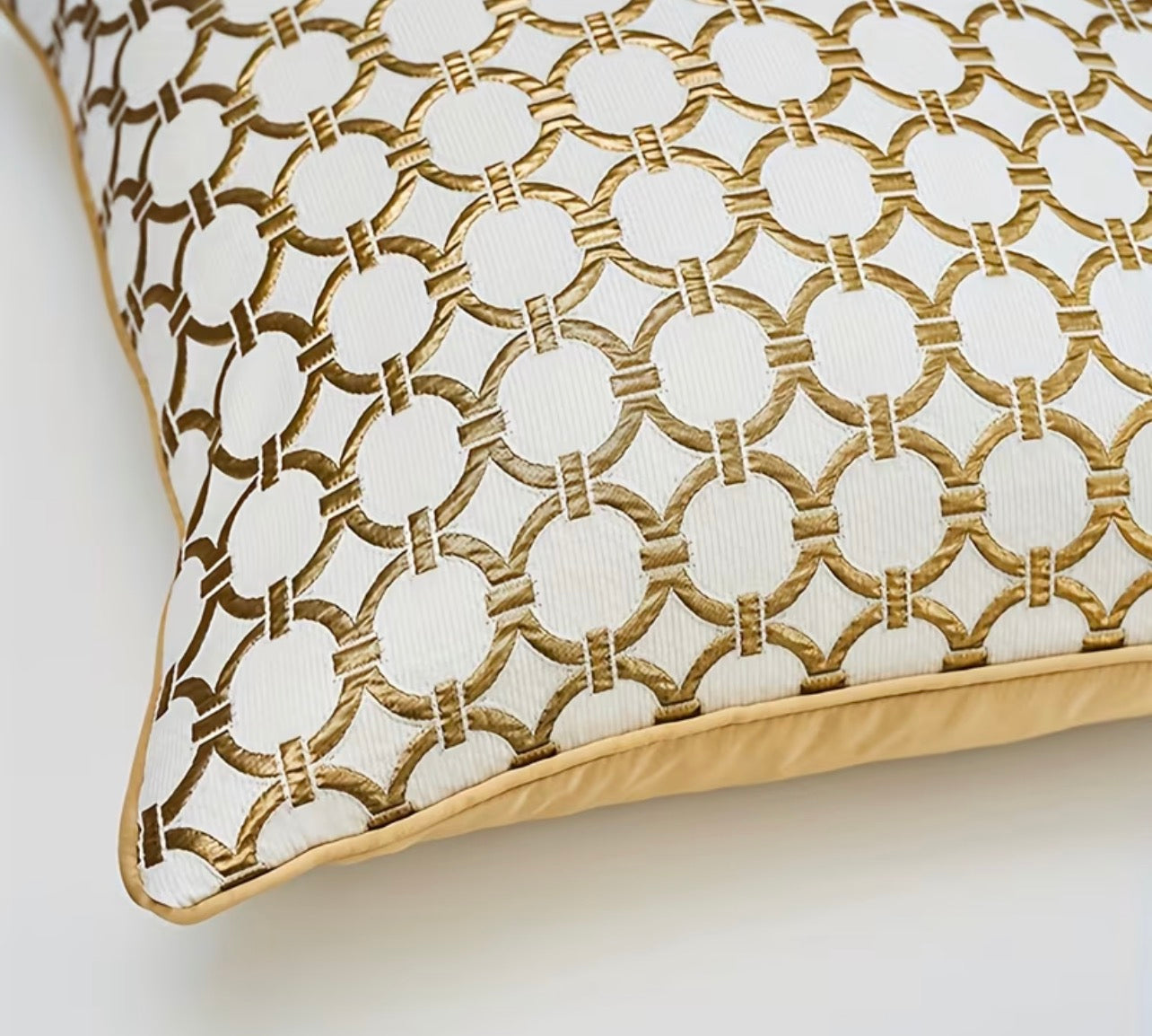 Decorative pillow with geometric pattern on a plain background