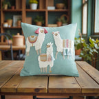 Decorative pillow with llama illustrations on a wooden table