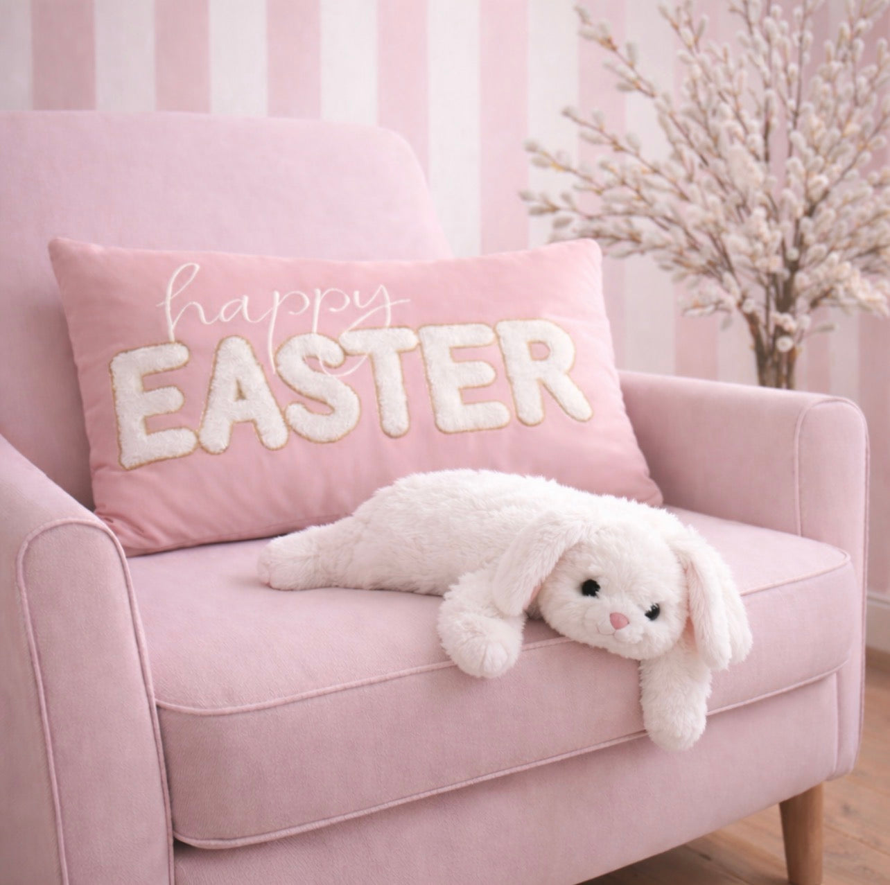 Pink chair with a 'Happy Easter' pillow and a plush bunny on a striped background