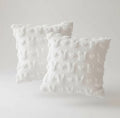 Two textured white pillows on a light gray background