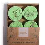 Four green shower steamers in a box labeled 'Ancient Wisdom' on a white background