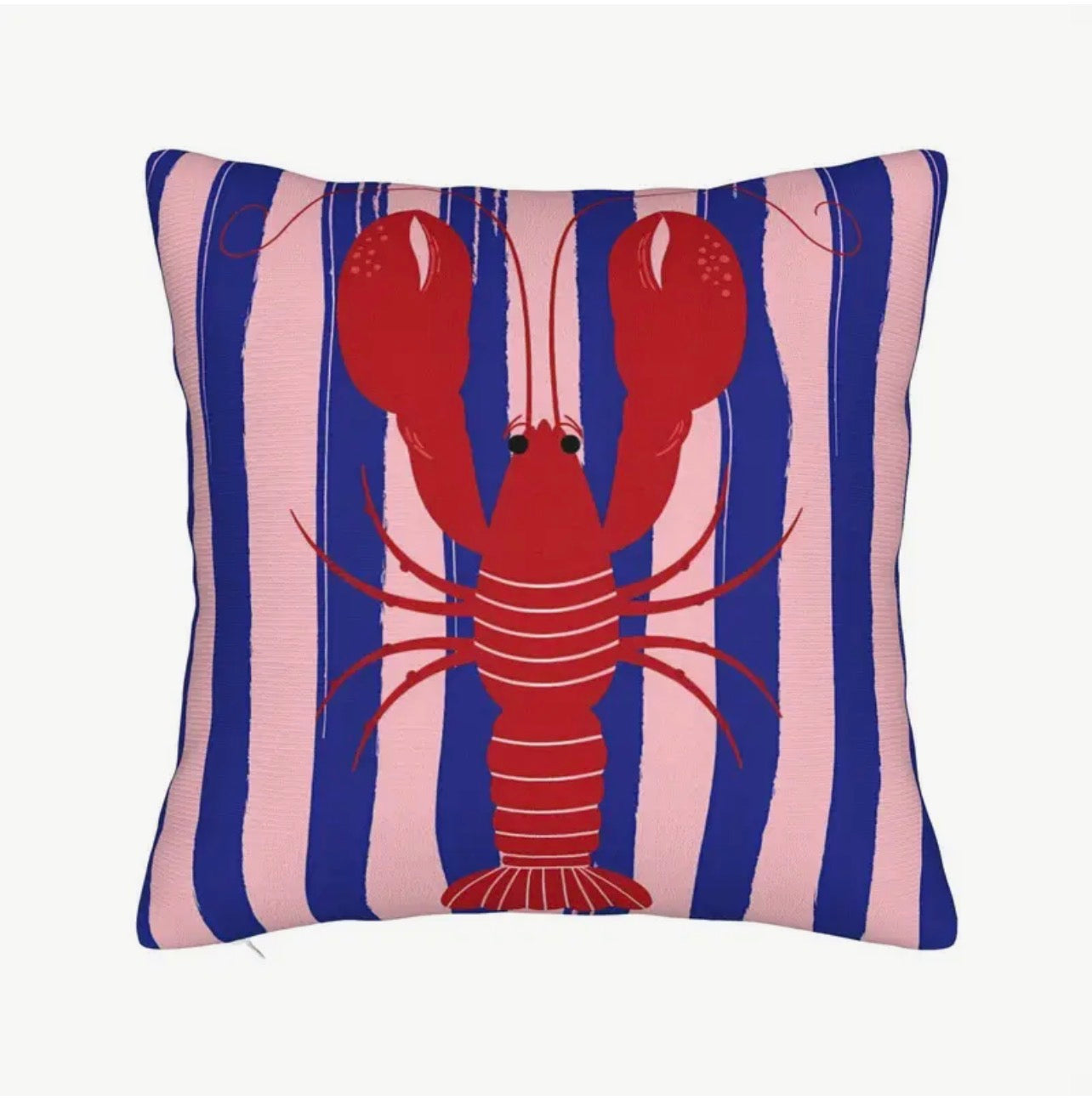 Pillow with a red lobster design on a blue and pink striped background