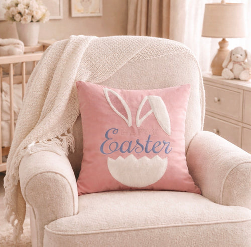 Pink Easter pillow with bunny ears on a beige armchair in a cozy room.