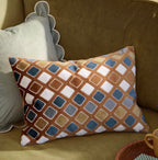 Decorative pillow with geometric pattern on a couch