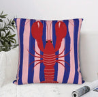 Decorative pillow with a red lobster on a blue and pink striped background